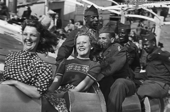 German <I>Fräuleins</i> [Young Ladies] and American Soldiers on a Rollercoaster (1945)  